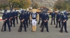 ROTC Air Force Honor Guard stands in formation with BYU Mascot Cosmo the Cougar