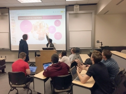 Members of the BYU Marriott Marketing Lab work together to brainstorm ideas for a client.