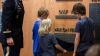 Three of the Taylor children unveil their father's name on BYU's Memorial Wall.