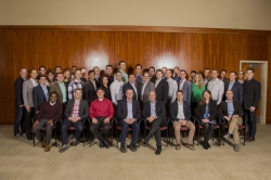 Faculty advisers, Paul Godfrey and Eliot Jacobsen pose with forty Cougar Strategy Group students in 2018 for a company photo