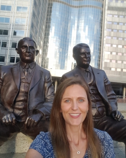 Gertsch in front of the statues of William and Charles Mayo at the Mayo Clinic in Rochester, Minnesota. Photo courtesy of Emily Gertsch.