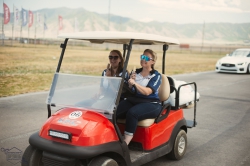 Melissa Jensen (left) enjoying the racetrack at her internship with the Utah Motorsports Campus. Photo courtesy of Melissa Jensen.