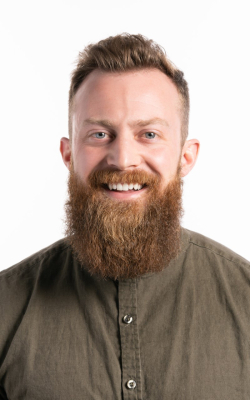 Headshot of Blake Marchant, a white man with red hair and a long red beard.