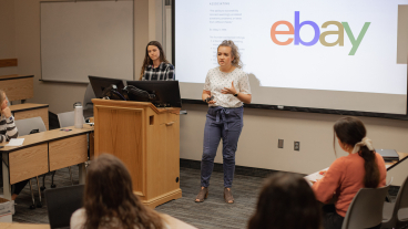 Mikayla Cluxton presenting in front of a group of women during a Women in Entrepreneurship workshop.