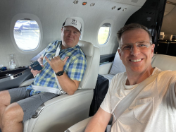 Cook with business partner Tom Karren on their way to a conference.  Photo courtesy of Travis Cook.