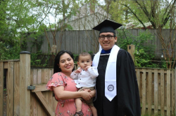 Moreno on his graduation day with his wife, Laura, and their son, Benjamin. Photo courtesy of Wilson Moreno.