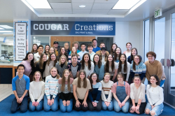 Fox (second row from bottom, far left) with her coworkers at Cougar Creations. Photo courtesy of Alexa Fox.