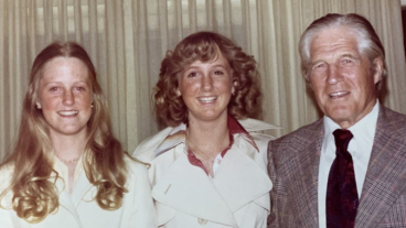Sue Mika and her older siblings Jody and Brett standing next to George W. Romney