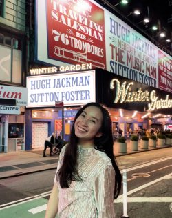 Ching Tong in front of a Broadway Theater