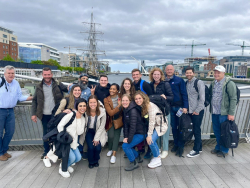 Ashley Wallace (bottom row, right) with her Banqu team in Ireland for their business summit. Photo courtesy of Ashley Wallace.