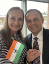 Clark Pew and his wife holding the flag of India.