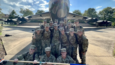 AFROTC cadets pictured in front of an airplane.