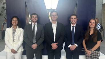 Melissa Mains, Clayton Roberts, Eli Nelson, Wesley Olsen, and Miriam Call pose for a photo together in the Tanner building.