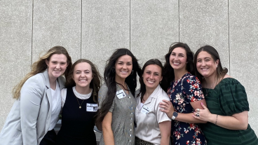 Six ExDM students pose for a picture outside the Church Office Building