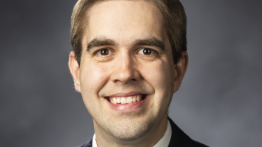 Jeffery Pickerd smiles at the camera in a professional headshot.