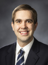 Jeffery Pickerd smiles at the camera in a professional headshot.