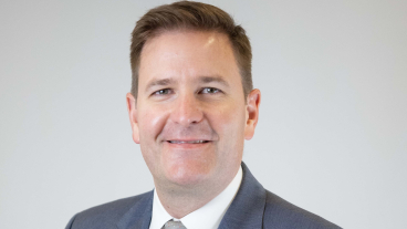 Paul Lambert smiles in a professional headshot.