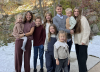 Bednar poses for a family photo with his wife and children.