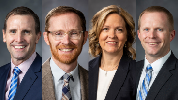 John Bingham, Michael Drake, Melissa Larson, and David Wood smile in professional headshots.